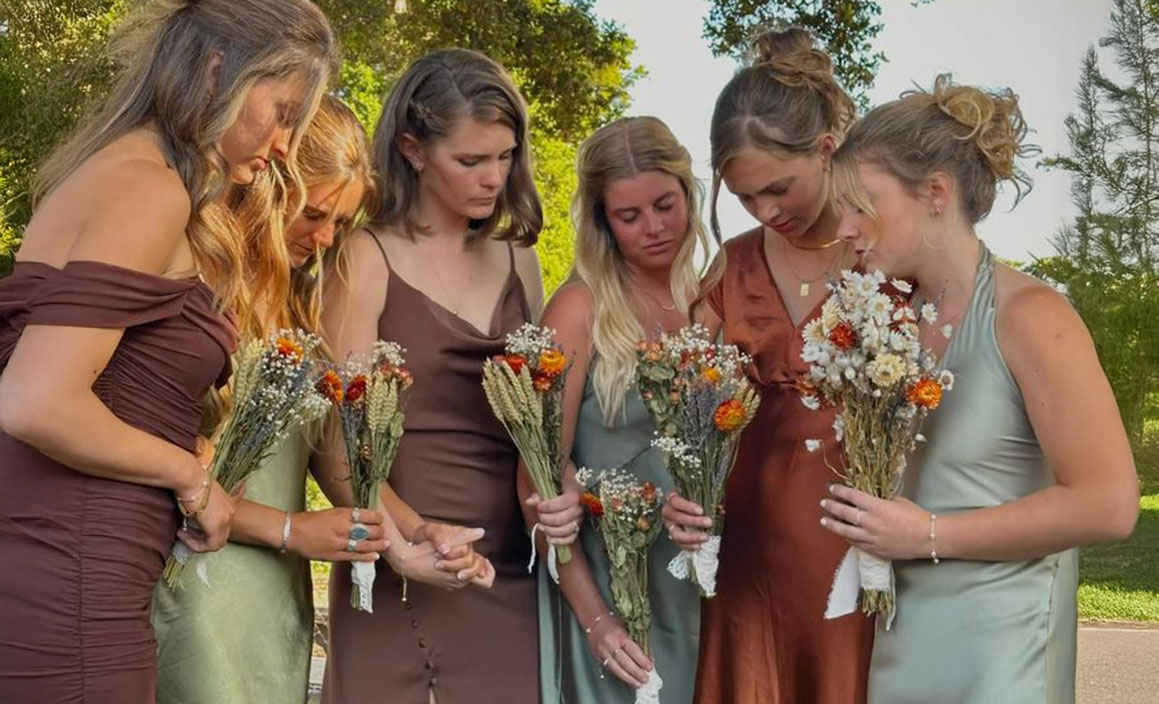 Attractive brunette girl in pink dress.